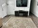 Living room with electric fireplace and large TV at 81 Middleton Rd, Franklin, IN 46131