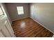 Simple bedroom with wood-look floors and neutral walls at 9120 Jene Ct, Indianapolis, IN 46234