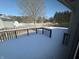 Wooden deck overlooking snowy backyard with shed visible at 9120 Jene Ct, Indianapolis, IN 46234