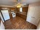 Bright kitchen with wood cabinets, laminate floor, and white appliances at 9120 Jene Ct, Indianapolis, IN 46234