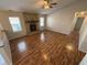Living room with laminate floors, stone fireplace and large windows at 9120 Jene Ct, Indianapolis, IN 46234