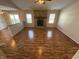 Living room with hardwood floors and a stone fireplace at 9120 Jene Ct, Indianapolis, IN 46234