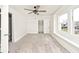 Cozy bedroom with gray carpet, ceiling fan, and window at 926 N Dearborn St, Indianapolis, IN 46201