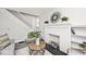 Living room featuring a white brick fireplace and built-in shelving at 926 N Dearborn St, Indianapolis, IN 46201