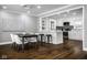 Bright dining area with dark hardwood floors and modern furnishings at 101 E 96Th St, Indianapolis, IN 46240