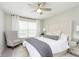 Spacious bedroom with a comfortable bed and seating area at 10500 Sanford Ct, Fishers, IN 46040