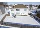 Aerial view of a two-story house with a snow-covered backyard at 10963 Field Crescent Cir, Noblesville, IN 46060