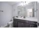 Bathroom with dark vanity and marble countertop at 10963 Field Crescent Cir, Noblesville, IN 46060