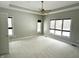 Large main bedroom with ceiling fan, neutral walls, and plush carpeting at 1238 Passage Way, Plainfield, IN 46168