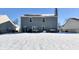 Backyard view of two-story house, snow on the ground, and patio furniture at 126 Hilltop Farms Blvd, New Whiteland, IN 46184