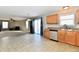 Kitchen features oak cabinets, stainless steel appliances, and tile floor at 126 Hilltop Farms Blvd, New Whiteland, IN 46184