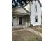 Two-story house with front porch, needing some repairs at 136 S Spencer Ave, Indianapolis, IN 46219