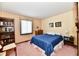 Bedroom with double bed, bookcase, and window at 1619 Beech Cir, Plainfield, IN 46168