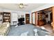 Relaxing living room featuring a TV, bookshelves, and comfortable seating at 1619 Beech Cir, Plainfield, IN 46168