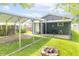 Spacious backyard featuring a fire pit area, covered carport, and a patio area for outdoor living at 1704 Nelson Ave, Indianapolis, IN 46203