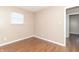 Bedroom with window, closet, and access to another room at 1704 Nelson Ave, Indianapolis, IN 46203
