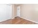 Bedroom with double door closet and wood-look floors at 1704 Nelson Ave, Indianapolis, IN 46203