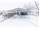 Exterior view of carport and backyard in the snow at 1704 Nelson Ave, Indianapolis, IN 46203
