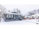 Gray house with snow covered lawn at 1704 Nelson Ave, Indianapolis, IN 46203