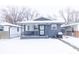 Gray house with snow covered lawn at 1704 Nelson Ave, Indianapolis, IN 46203