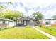 Charming home featuring a covered front porch and a well-manicured lawn, perfect for curb appeal at 1704 Nelson Ave, Indianapolis, IN 46203