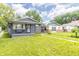 Charming home featuring a covered front porch and a well-manicured lawn, set in a cozy neighborhood at 1704 Nelson Ave, Indianapolis, IN 46203