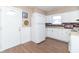 Kitchen with white cabinets and brick backsplash at 1704 Nelson Ave, Indianapolis, IN 46203