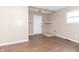 Living room with wood flooring and a brick fireplace at 1704 Nelson Ave, Indianapolis, IN 46203