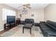 Living room with two black couches and a TV at 1704 Nelson Ave, Indianapolis, IN 46203