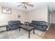 Living room with two black couches and a TV at 1704 Nelson Ave, Indianapolis, IN 46203