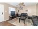 Living room with two black couches and a TV at 1704 Nelson Ave, Indianapolis, IN 46203