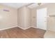 Living room featuring wood flooring and a brick fireplace at 1704 Nelson Ave, Indianapolis, IN 46203