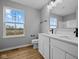 Modern bathroom featuring a dual sink vanity, modern fixtures, and natural light from a window at 1705 Real St, Indianapolis, IN 46240