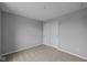 Cozy bedroom with carpet flooring, closet with sliding doors, and neutral paint at 1705 Real St, Indianapolis, IN 46240