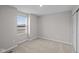 Bright bedroom featuring a window, plush carpet and natural light at 1705 Real St, Indianapolis, IN 46240