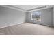 Large bedroom with neutral carpet, a tray ceiling and ample natural light at 1705 Real St, Indianapolis, IN 46240