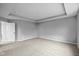 Spacious bedroom with neutral carpet, a tray ceiling and ample natural light at 1705 Real St, Indianapolis, IN 46240