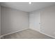 Spare bedroom showcases a closet, plush carpet and natural light at 1705 Real St, Indianapolis, IN 46240