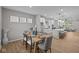 Bright dining area with modern table set, and an open view into the stylish kitchen at 1705 Real St, Indianapolis, IN 46240