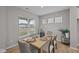 Bright dining room with large window, wood floors, a decorative table setting, and tasteful design at 1705 Real St, Indianapolis, IN 46240