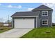 Two car garage and driveway on a beautiful home at 1705 Real St, Indianapolis, IN 46240