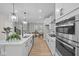 Modern kitchen featuring white cabinets, stainless steel appliances, and a spacious island at 1705 Real St, Indianapolis, IN 46240