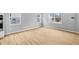 Bright living area with wood floors and multiple windows at 1705 Real St, Indianapolis, IN 46240