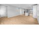 Open-concept living area with hardwood floors connecting the kitchen and other living spaces at 1705 Real St, Indianapolis, IN 46240