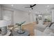 Inviting living room with wood floors and an open floor plan to the kitchen and dining area at 1705 Real St, Indianapolis, IN 46240