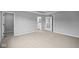 Large main bedroom with neutral carpet, walk-in closet and en-suite bathroom at 1705 Real St, Indianapolis, IN 46240