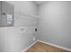 Bright utility room with shelving and washer/dryer hookups at 1705 Real St, Indianapolis, IN 46240