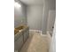 A view of the bathroom featuring a bathtub and vanity awaiting finishing touches at 1709 Real St, Indianapolis, IN 46240