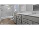 Bathroom features double sinks with quartz countertop and a walk-in shower at 1709 Real St, Indianapolis, IN 46240