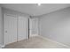 Bright bedroom featuring carpeted floors, and a double door closet at 1709 Real St, Indianapolis, IN 46240